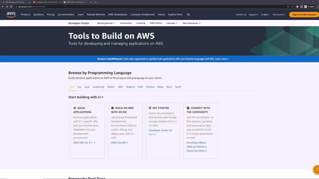 The image shows a webpage from AWS's Developer Center, highlighting tools for building applications on AWS, with a focus on programming languages like C++, Java, and Python. It includes sections for building applications, getting started, and connecting with the community.