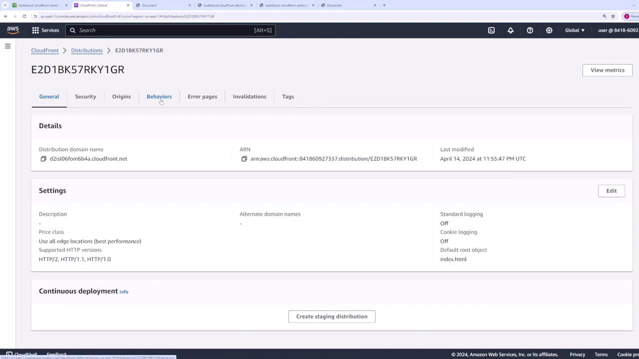 The image shows an AWS CloudFront distribution settings page, displaying details such as the distribution domain name, ARN, and settings like logging and HTTP versions.