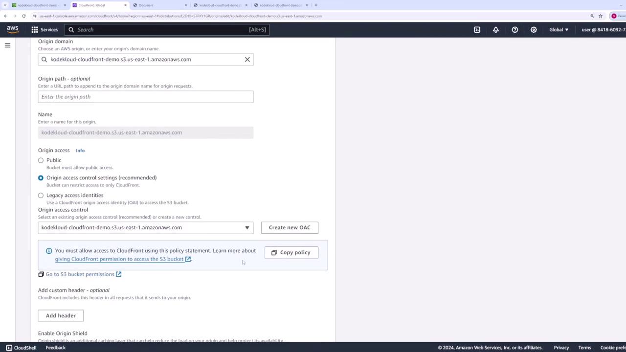 The image shows an AWS CloudFront configuration screen where an origin domain is being set up with options for origin access control settings. There are fields for entering the origin domain name and path, and options for access control settings.