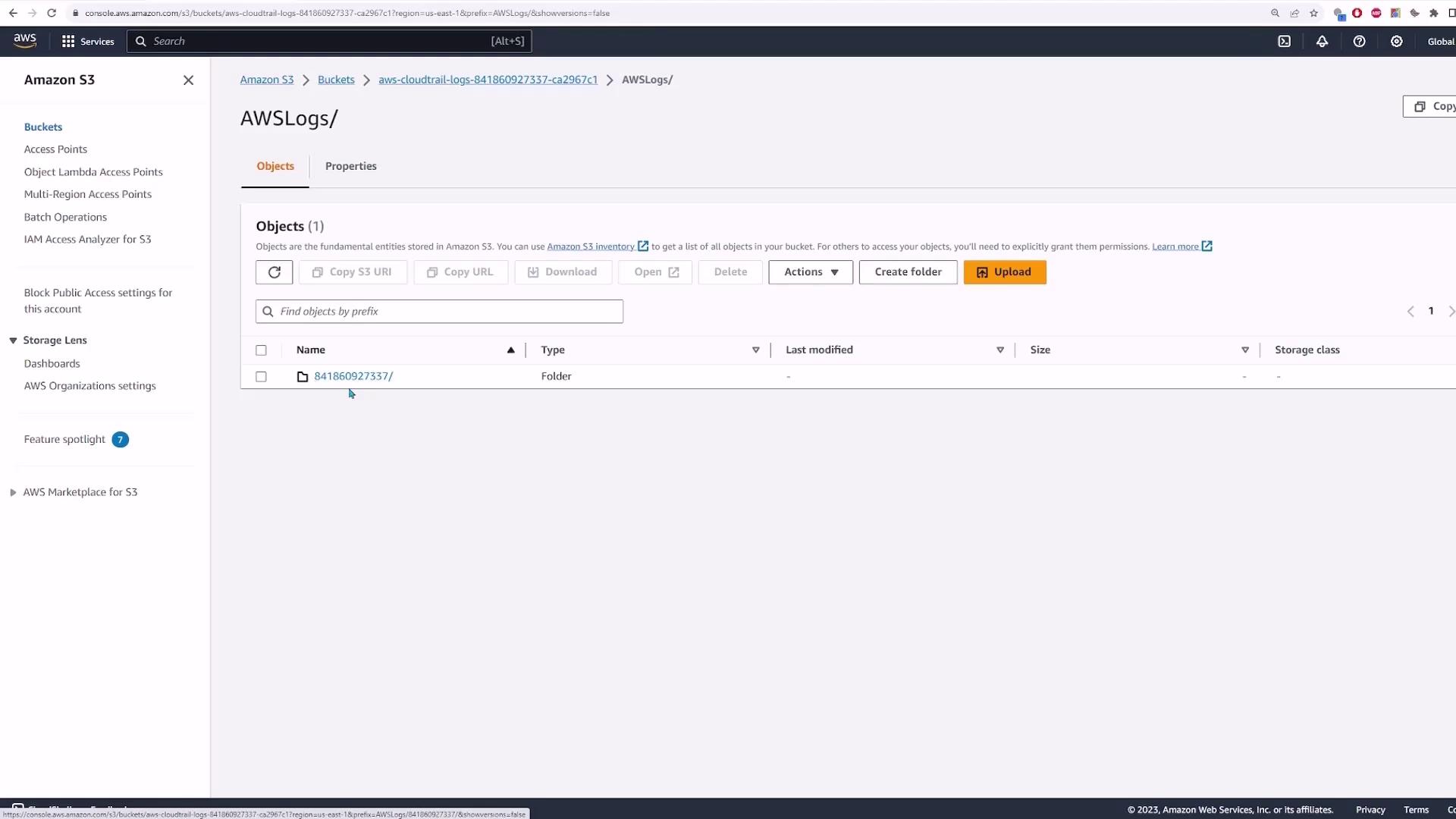 The image shows an Amazon S3 console with a bucket named "AWSLogs" containing a folder labeled "841860923737". The interface displays options for managing objects, such as creating folders and uploading files.
