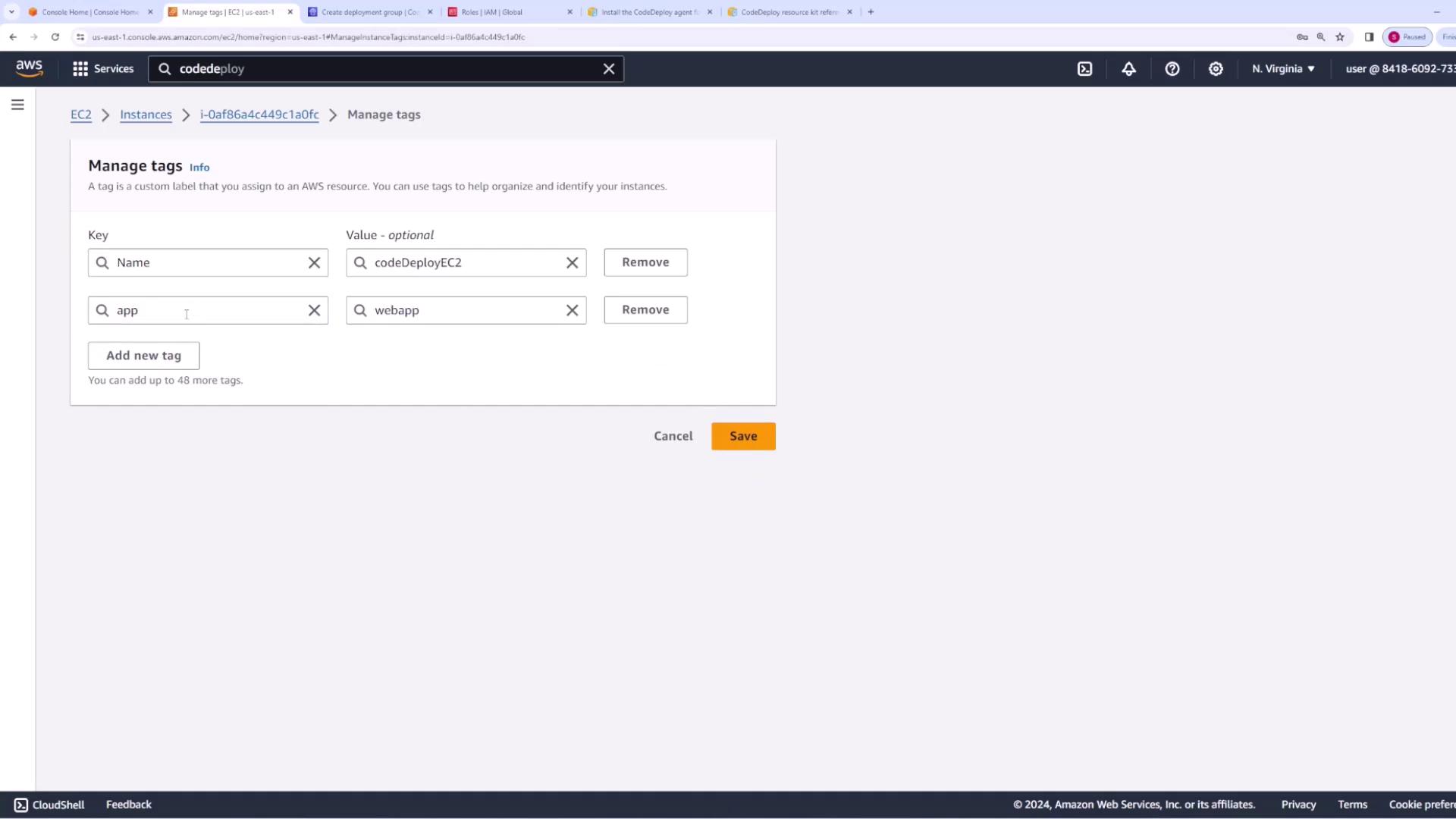 The image shows an AWS EC2 management console where tags are being managed for an instance. Two tags are listed: "Name" with the value "codeDeployEC2" and "app" with the value "webapp".