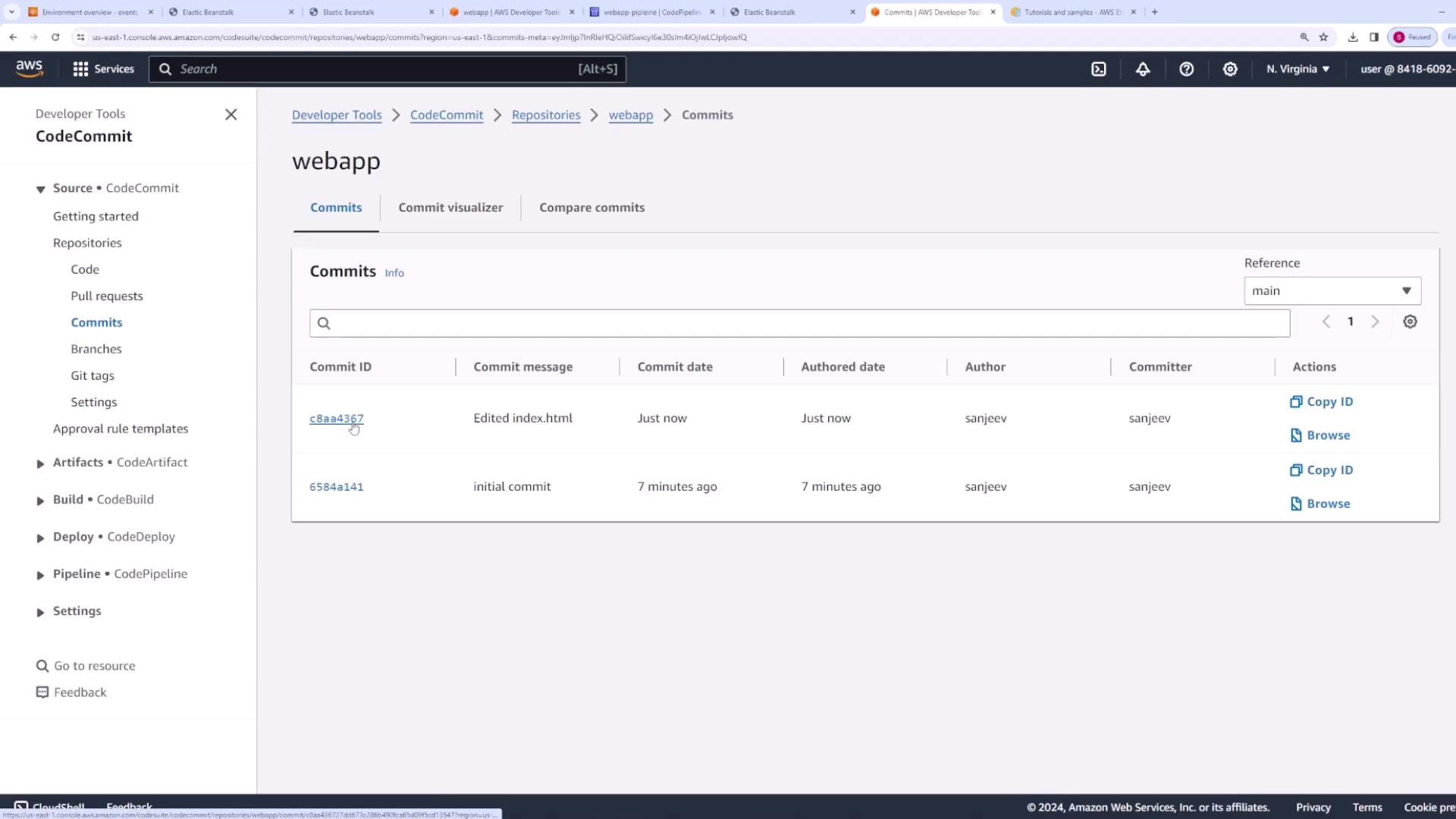 The image shows the AWS CodeCommit commits list for the "webapp" repository.