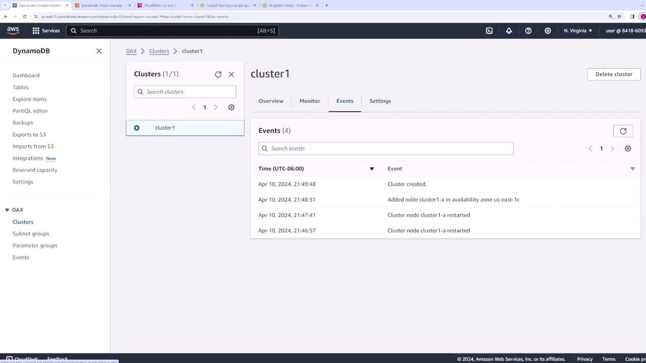 The image shows an AWS DynamoDB console displaying the events tab for a cluster named "cluster1," listing events such as cluster creation and node restarts.