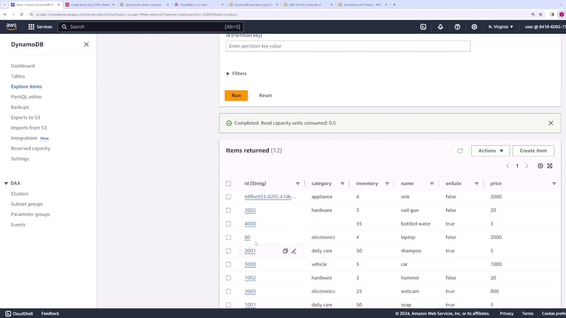 The image shows the AWS DynamoDB console with a list of items in a table, displaying details like ID, category, inventory, name, onSale status, and price.