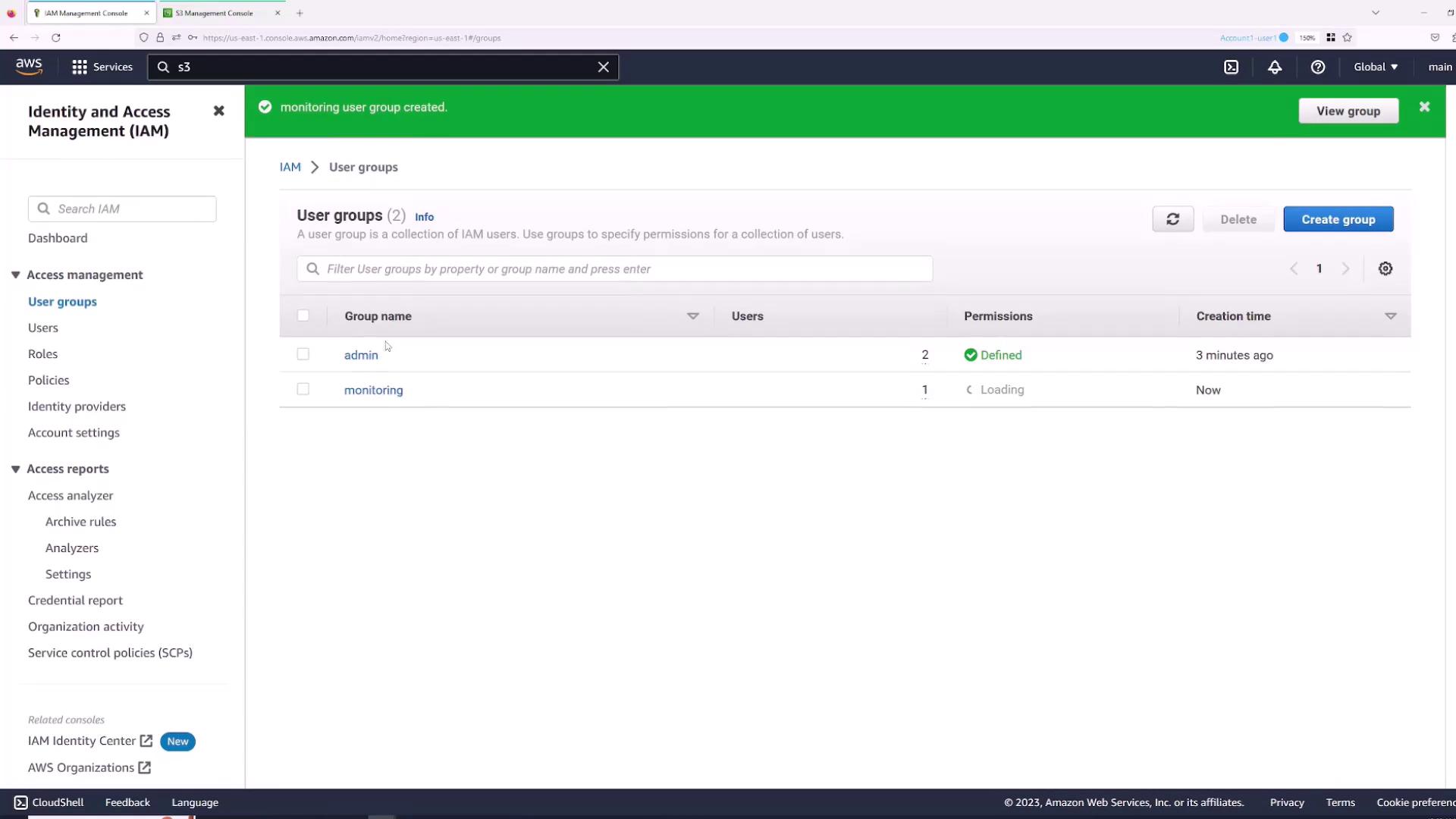 The image shows the AWS Identity and Access Management (IAM) console, specifically the "User groups" section, listing two groups: "admin" and "monitoring." A notification indicates that the "monitoring" user group was created.