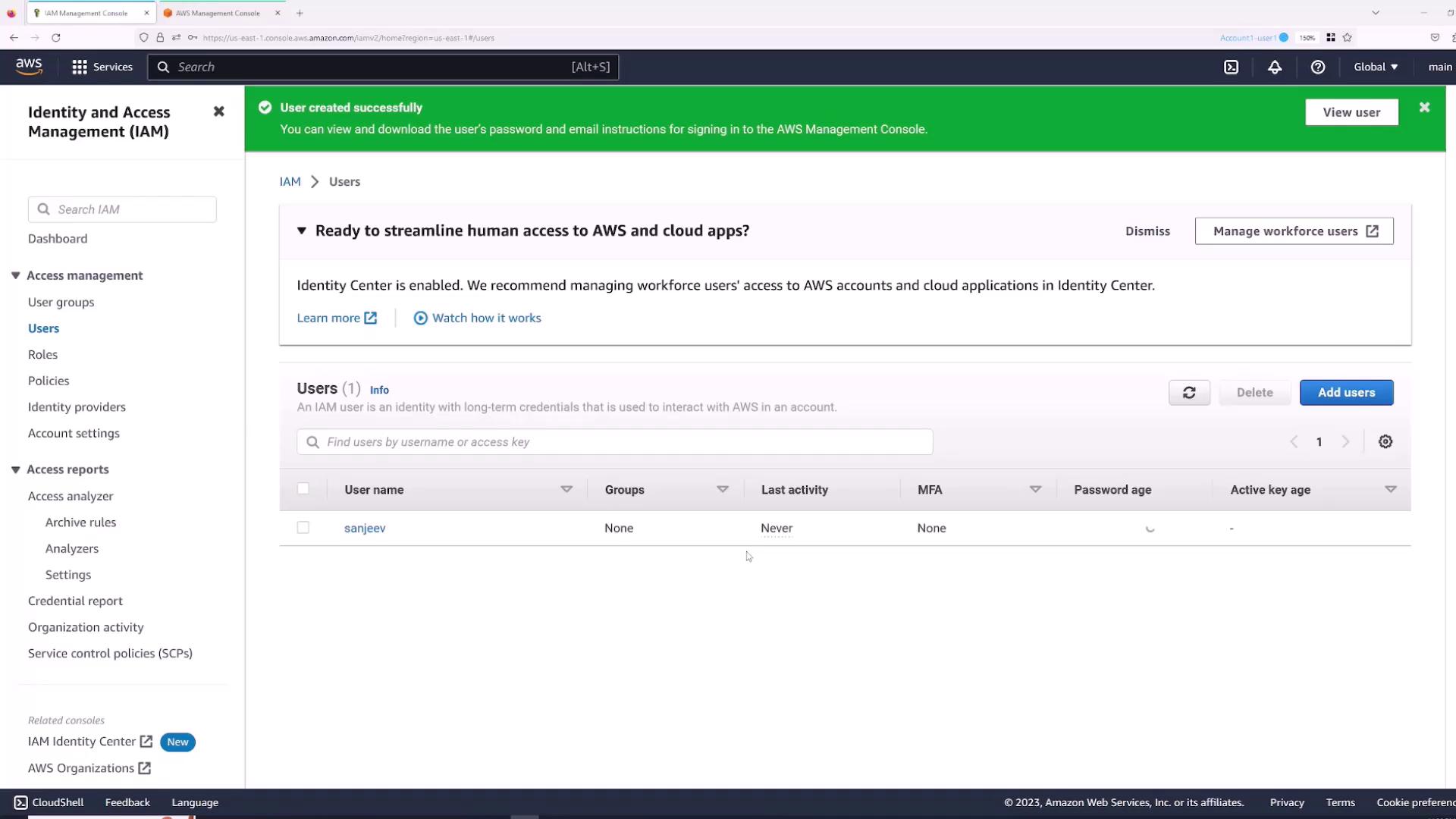 The image shows the AWS Identity and Access Management (IAM) console, displaying a user management interface with a notification about a user being created successfully.