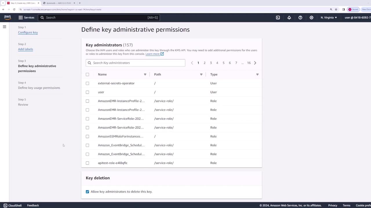 The image shows an AWS console interface for defining key administrative permissions, listing various IAM users and roles that can administer a key. It includes options for configuring key deletion permissions.