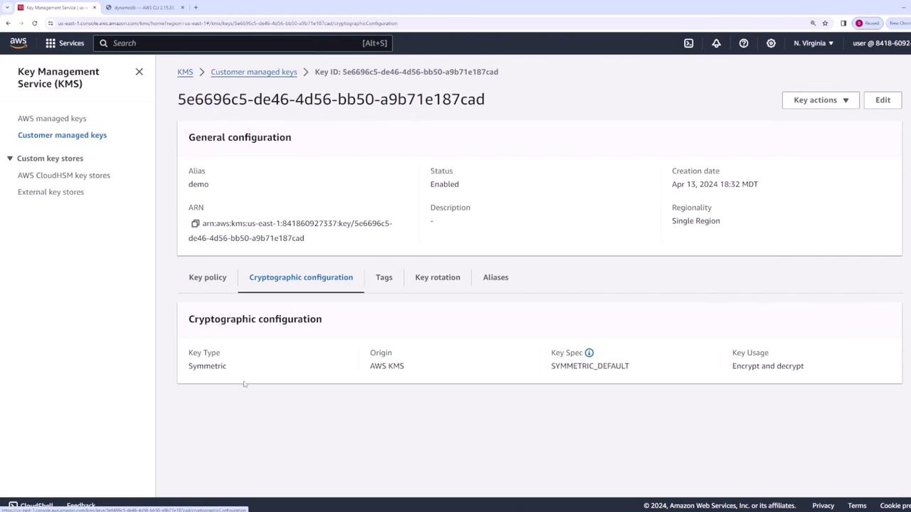The image shows an AWS Key Management Service (KMS) interface displaying details of a customer-managed key, including its ID, alias, status, and cryptographic configuration.