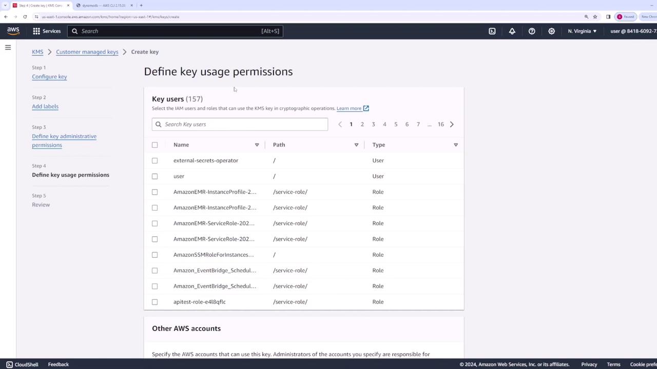 The image shows an AWS KMS console screen where key usage permissions are being defined for various IAM users and roles. It lists users and roles with options to select them for cryptographic operations.