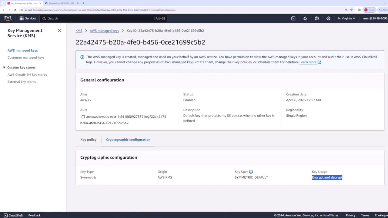 The image shows an AWS Key Management Service (KMS) console page displaying details of a managed key, including its ID, alias, status, and cryptographic configuration.