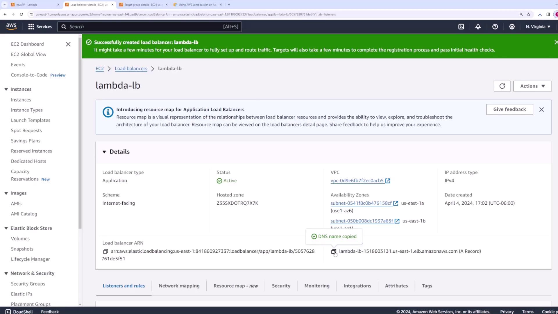 The image shows an AWS EC2 console page displaying details of an active application load balancer named "lambda-lb," including its status, VPC, and availability zones.