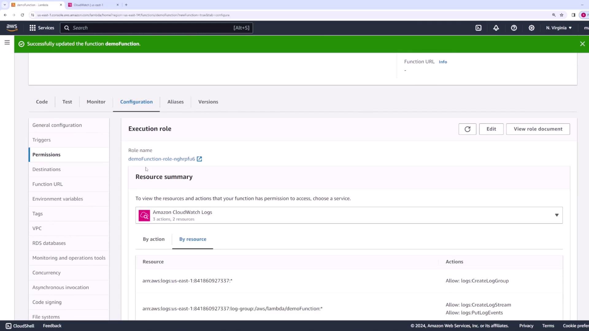 The image shows an AWS Lambda console screen, specifically the configuration tab for a function named "demoFunction." It displays the execution role details and resource permissions related to Amazon CloudWatch Logs.