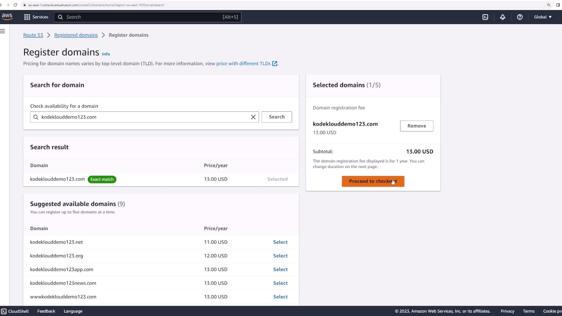 The image shows a domain registration page on AWS Route 53, where the domain "kodeklouddemo123.com" is selected for purchase at $13.00 USD per year, with an option to proceed to checkout.