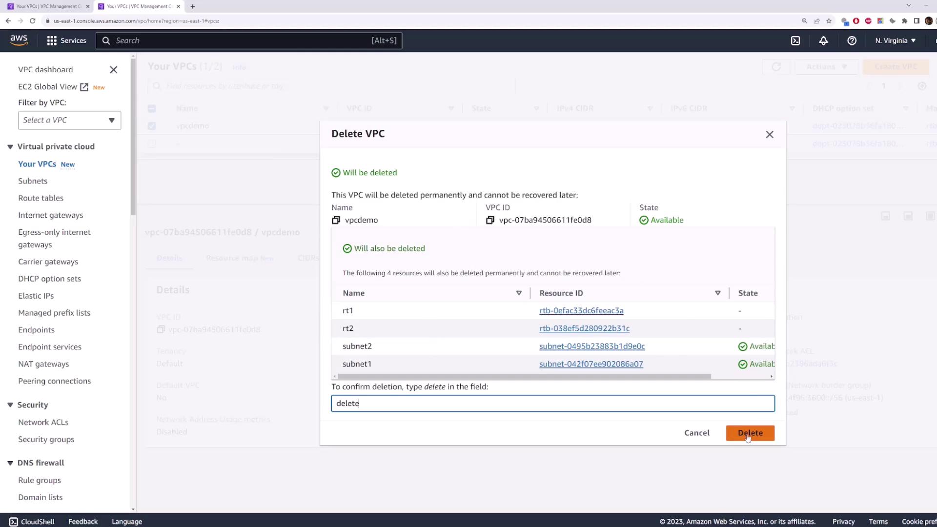 The image shows an AWS management console screen where a user is in the process of deleting a VPC named "vpcdemo" along with its associated resources. The user has typed "delete" to confirm the action.