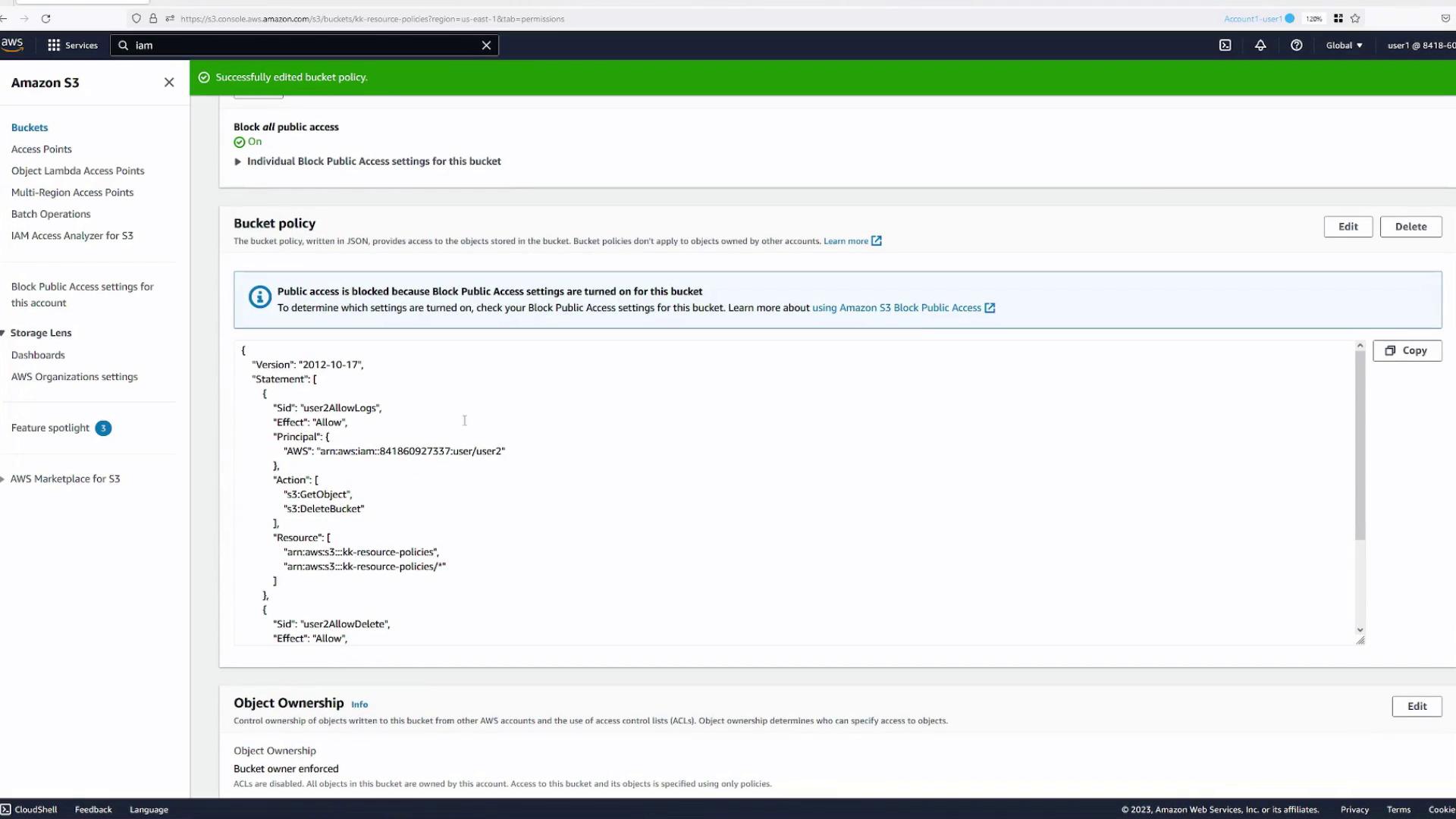 The image shows an Amazon S3 bucket policy configuration screen with JSON code detailing access permissions. Public access is blocked, and specific user permissions are outlined.
