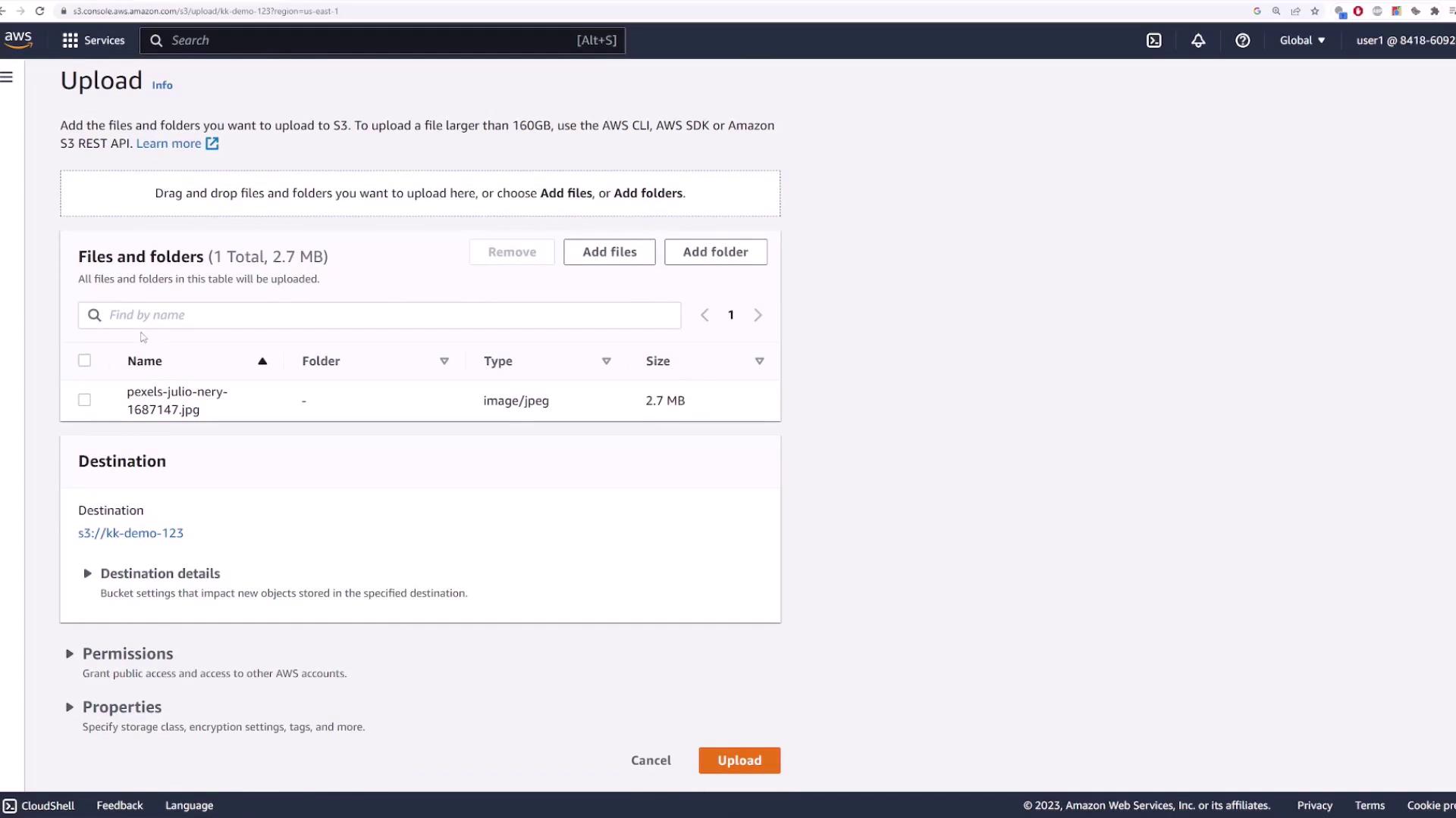 The image shows an AWS S3 upload interface with a file named "pexels-julio-nery-1687147.jpg" ready to be uploaded to the "kk-demo-123" bucket. The file is 2.7 MB in size.