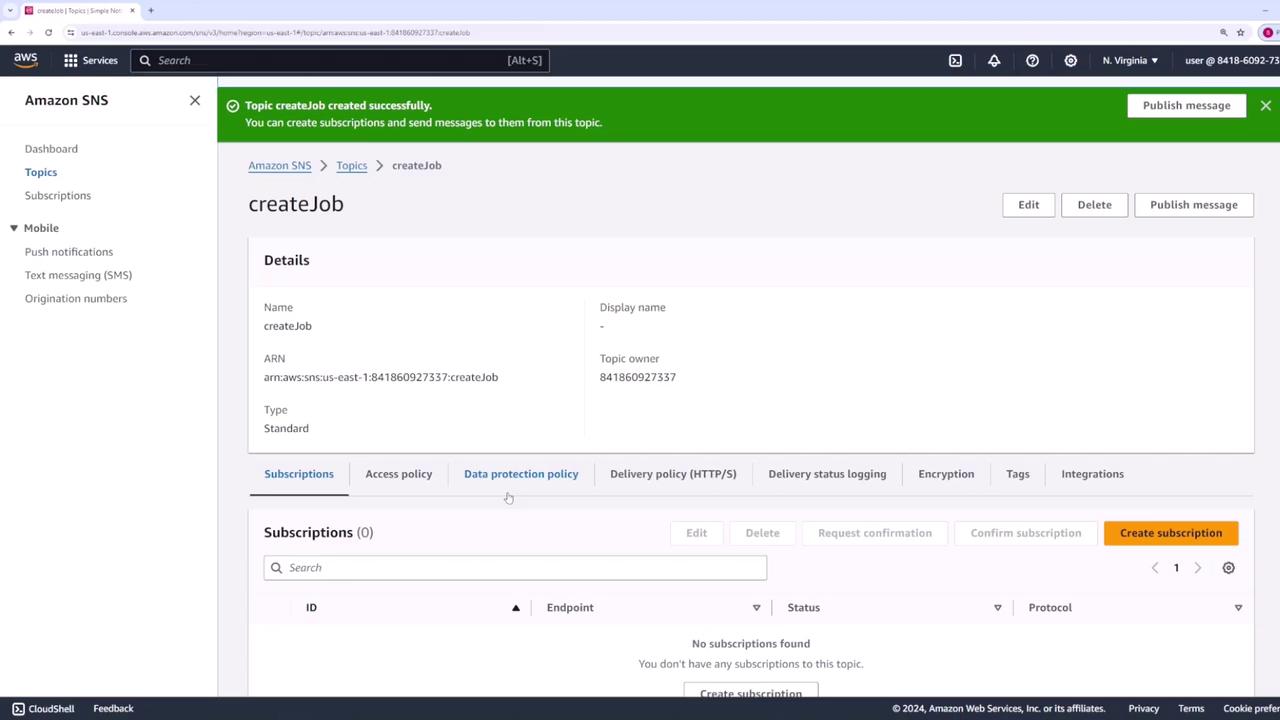 The image shows an Amazon SNS (Simple Notification Service) console screen with a topic named "createJob" successfully created, displaying its details and options for managing subscriptions and policies.