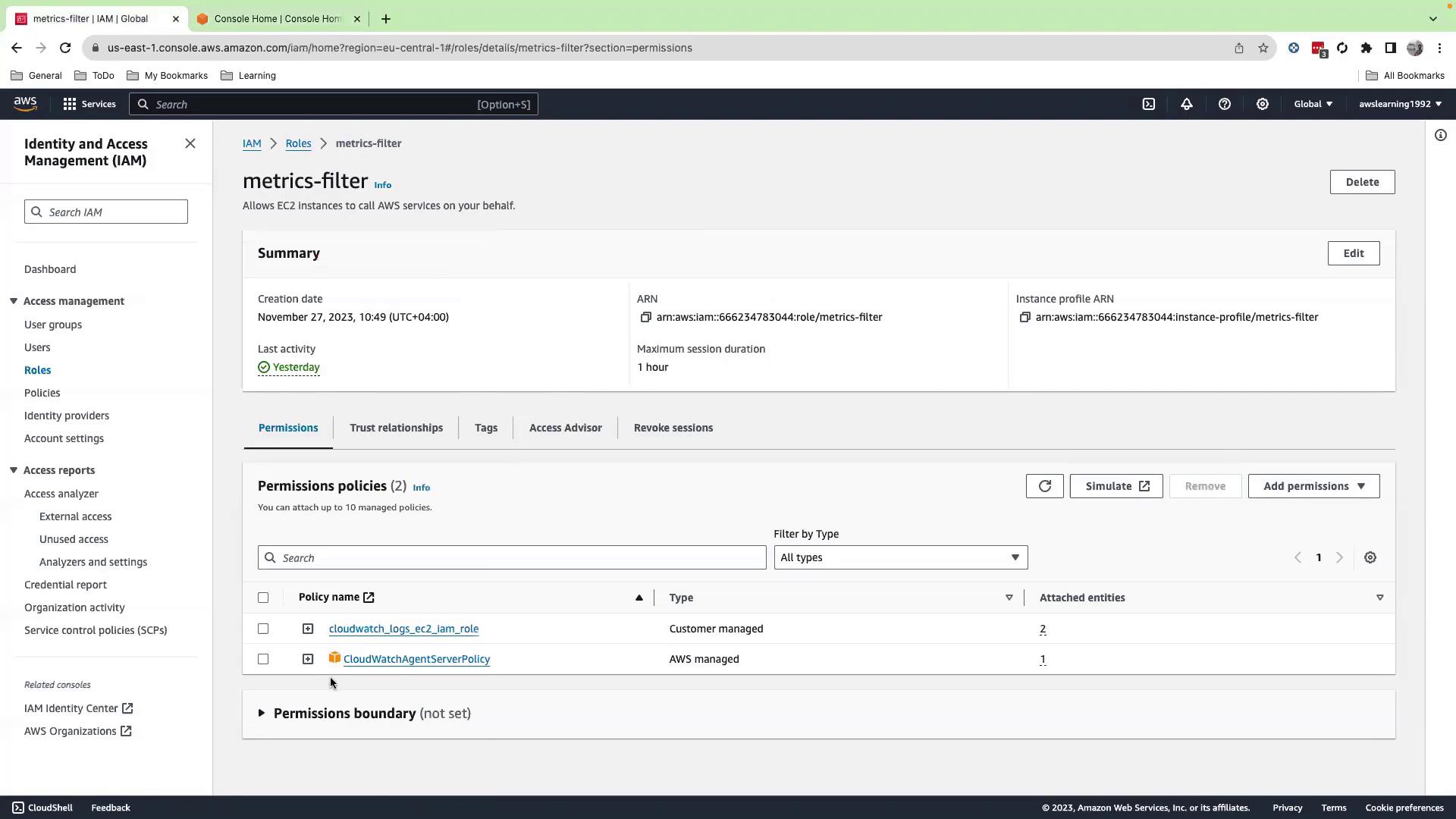 The image shows an AWS Identity and Access Management (IAM) console screen for a role named "metrics-filter," displaying its summary, permissions policies, and related details.