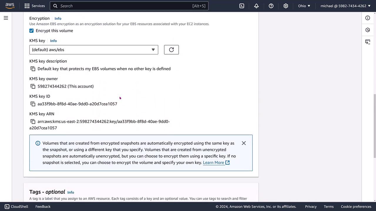 The image shows an AWS console screen for configuring encryption settings for EBS volumes, including options for selecting a KMS key and related details.