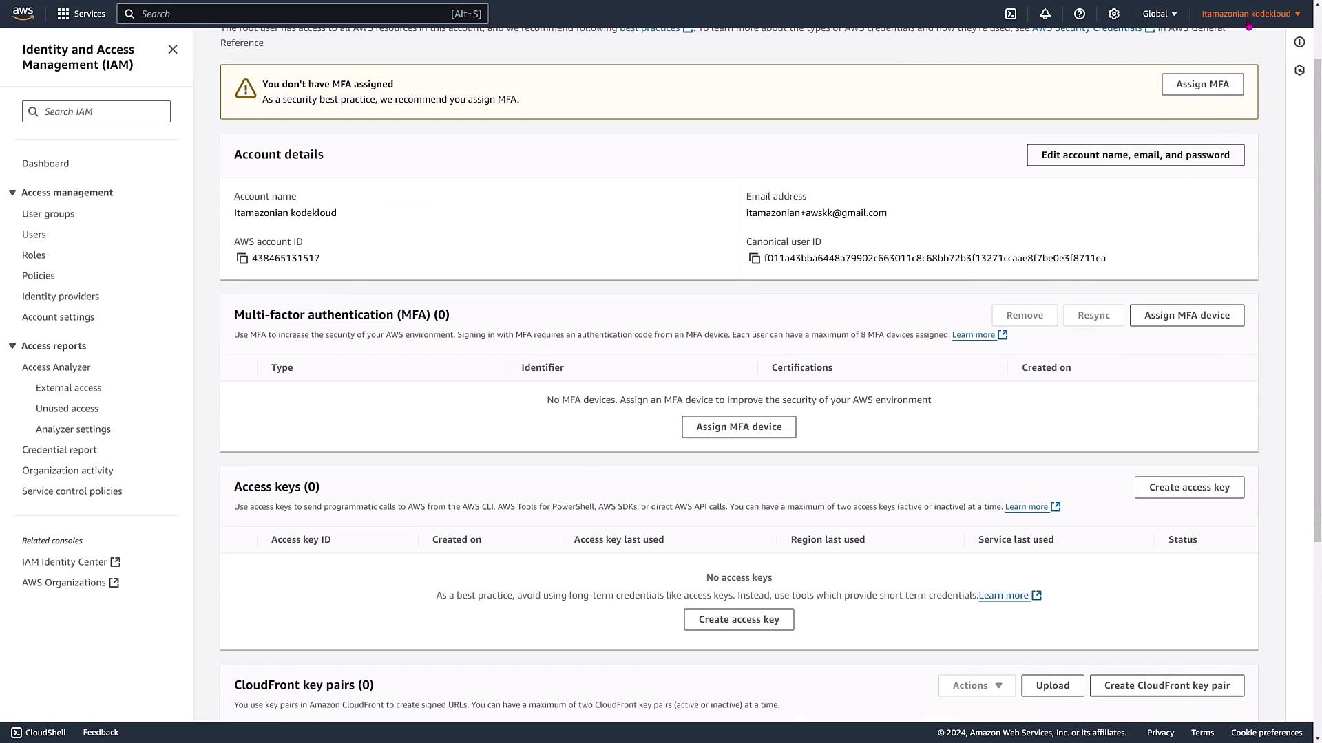 The image shows an AWS Identity and Access Management (IAM) dashboard, displaying account details, multi-factor authentication (MFA) options, and access key information. It highlights that no MFA is assigned and no access keys are created.