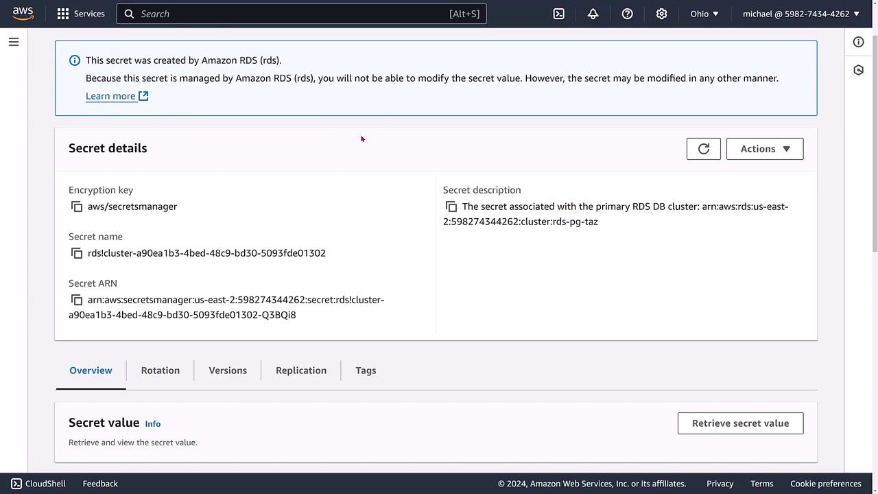 The image shows an AWS Secrets Manager interface displaying details of a secret related to an Amazon RDS database cluster, including the encryption key, secret name, and secret ARN.