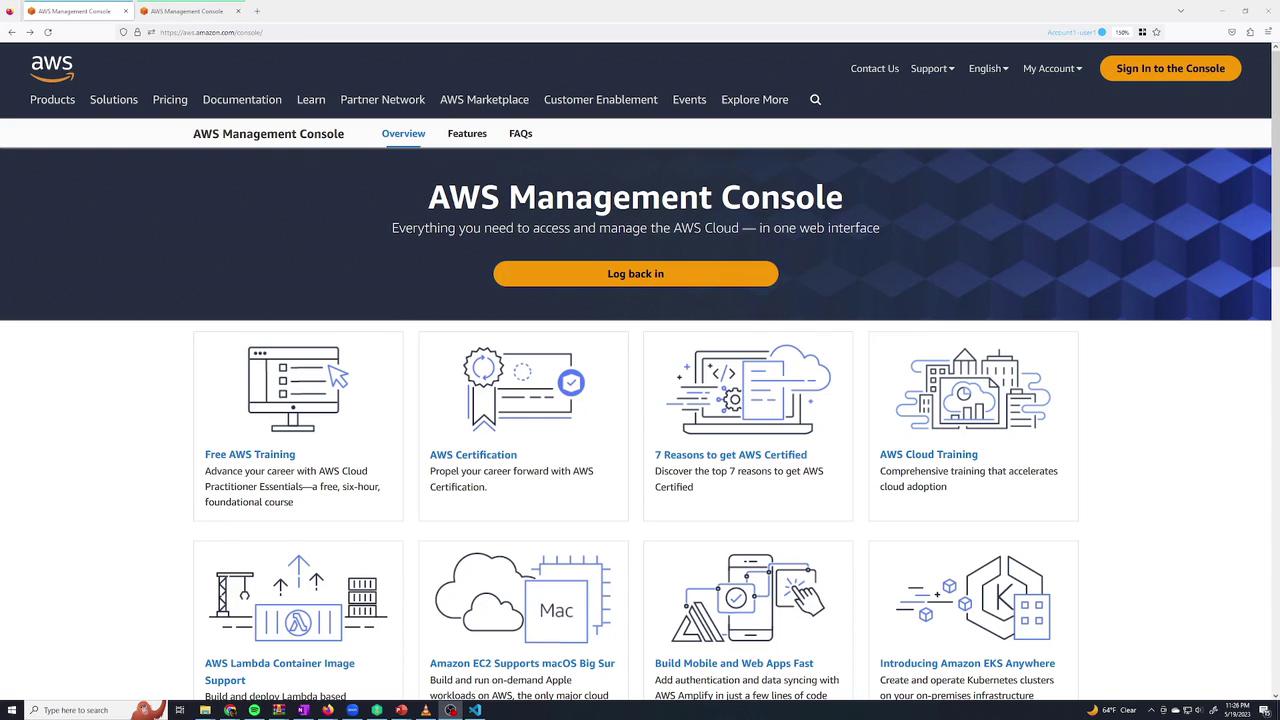 The image shows the AWS Management Console webpage, featuring options for AWS training, certification, and cloud services, with a "Log back in" button prominently displayed.