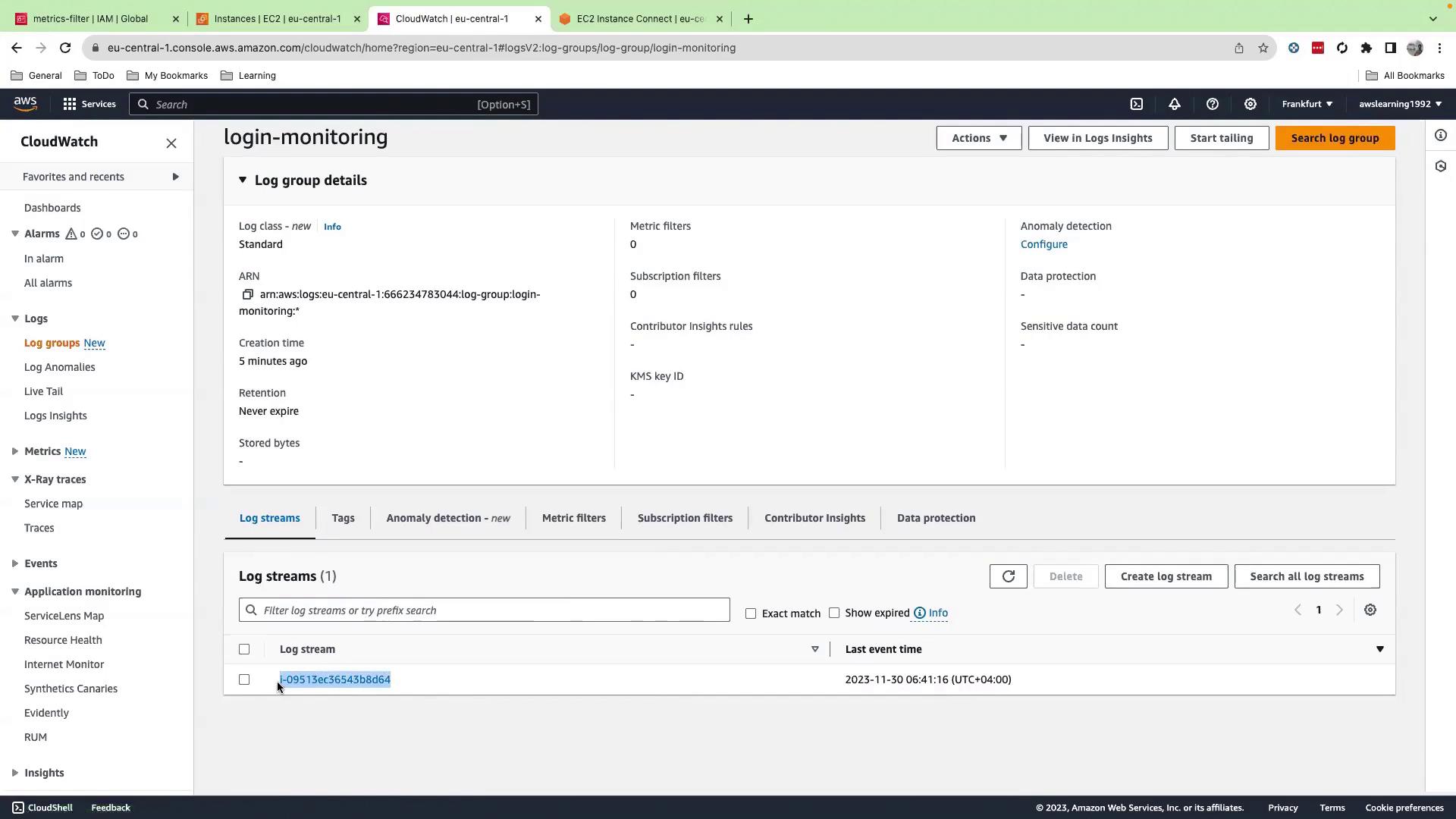 The image shows an AWS CloudWatch console displaying details of a log group named "login-monitoring," including log streams and configuration options.