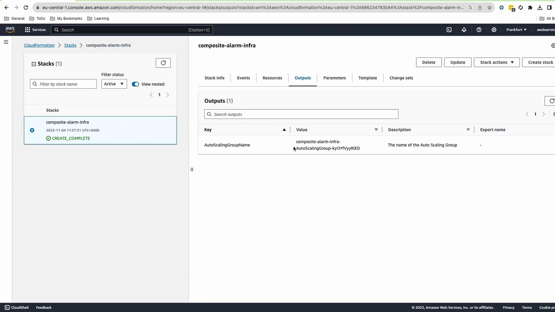 The image shows an AWS CloudFormation console with a stack named "composite-alarm-infra" that has a status of "CREATE_COMPLETE." The Outputs tab displays an AutoScalingGroupName with its corresponding value.