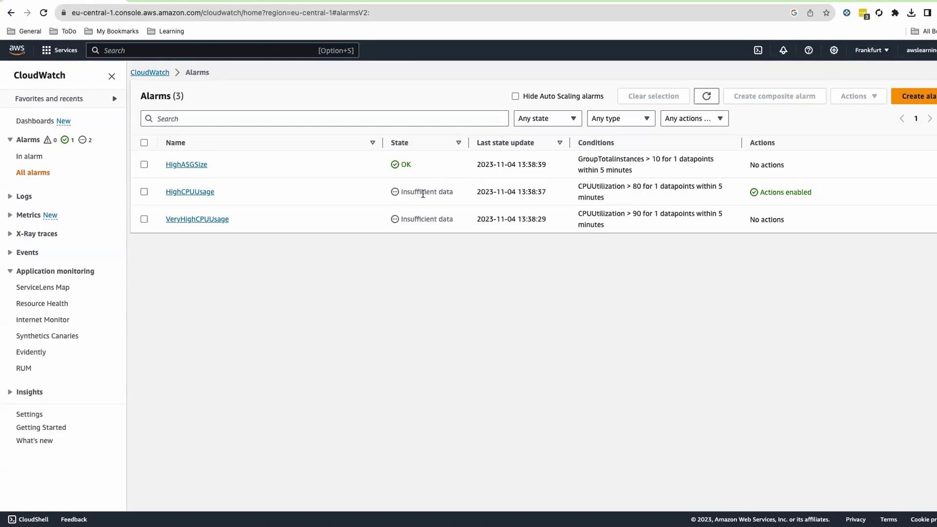 The image shows an AWS CloudWatch Alarms dashboard with three alarms listed, indicating their status and conditions. The alarms are named "HighASGSize," "HighCPUUsage," and "VeryHighCPUUsage," with varying states and conditions.