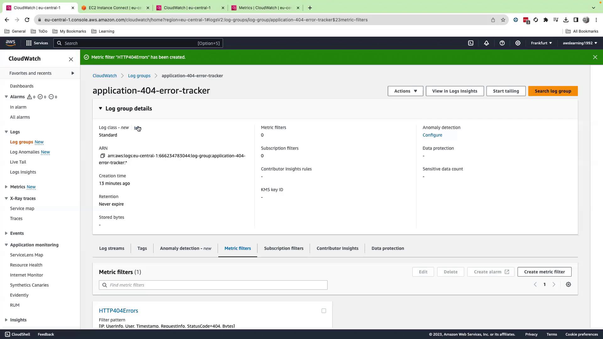 The image shows an AWS CloudWatch interface displaying details of a log group named "application-404-error-tracker," including metrics and configuration options.