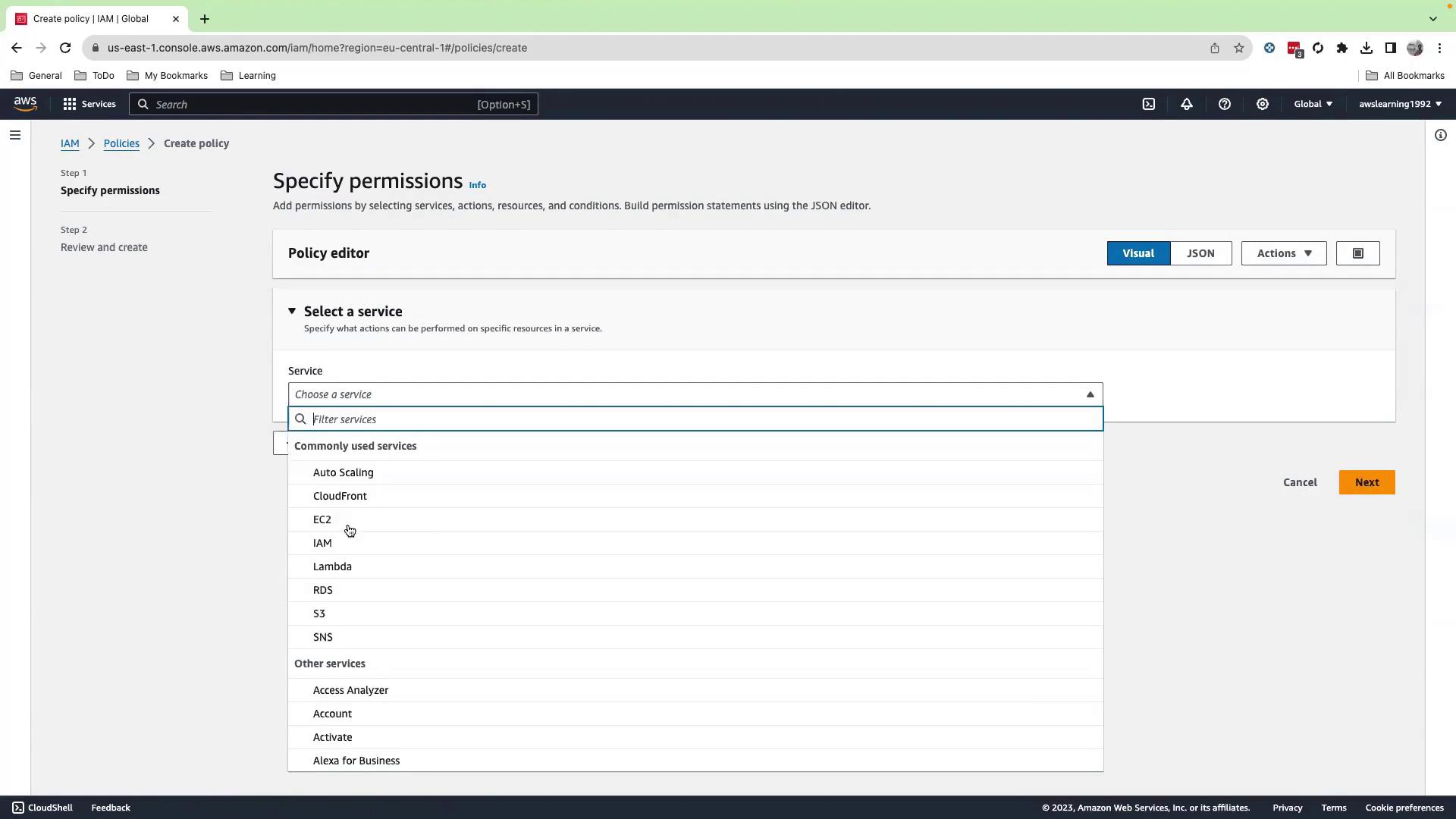 The image shows an AWS IAM console screen where a user is specifying permissions for a policy by selecting a service from a dropdown menu. Commonly used services like EC2, Lambda, and S3 are listed.