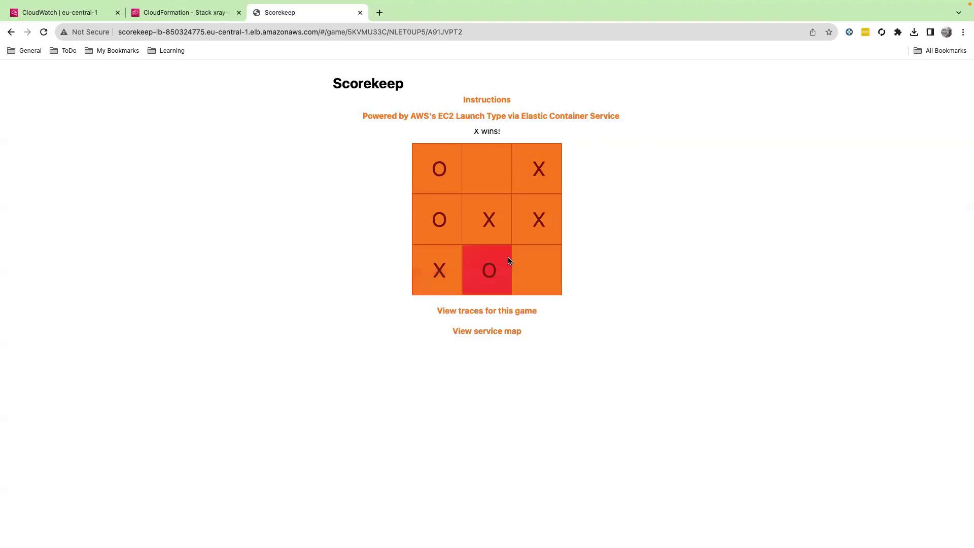 The image shows a tic-tac-toe game where "X" has won. It is displayed on a webpage with options to view game traces and a service map.