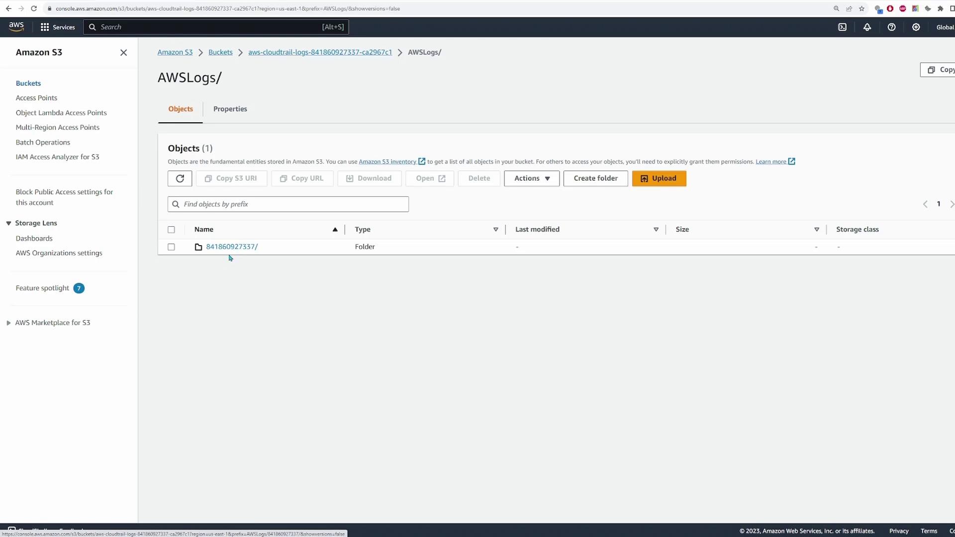 The image shows an Amazon S3 console with a bucket named "AWSLogs" containing a folder labeled "841860927337/". The interface displays options for managing objects, such as creating folders and uploading files.