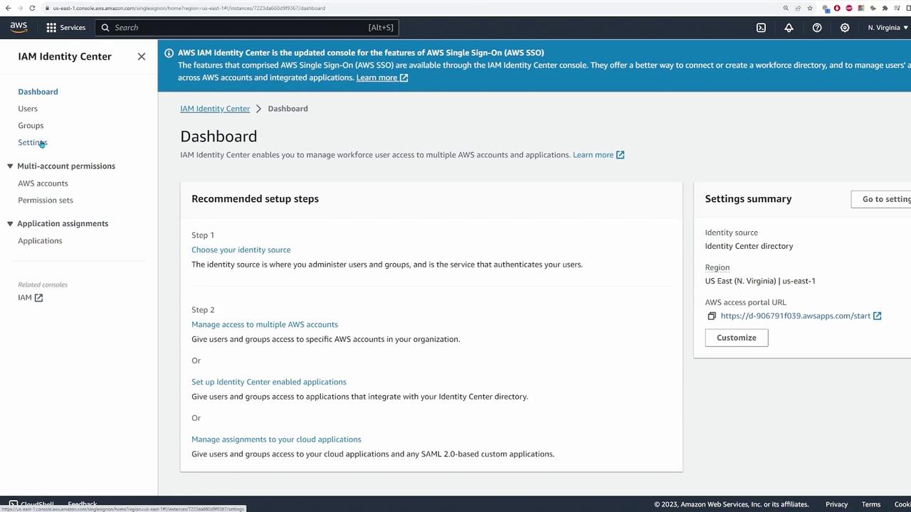The image shows the AWS IAM Identity Center dashboard, displaying recommended setup steps and a settings summary for managing user access to AWS accounts and applications.
