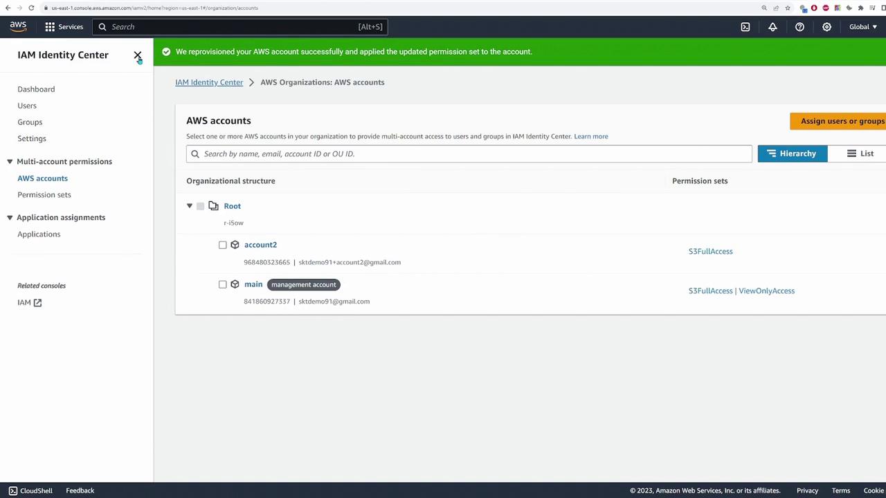 The image shows the AWS Identity Center interface, displaying a list of AWS accounts under an organizational structure with associated permission sets.