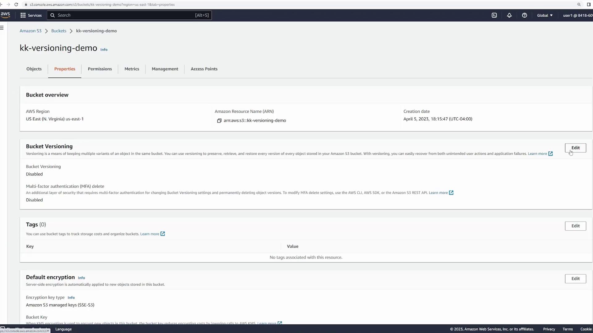 The image shows an Amazon S3 bucket properties page with details about bucket versioning, tags, and default encryption settings. The bucket versioning and multi-factor authentication (MFA) delete are both disabled.