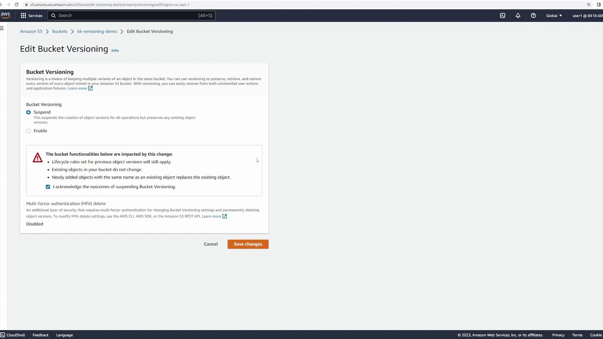 The image shows the "Edit Bucket Versioning" page in Amazon S3, where options to suspend or enable bucket versioning are displayed, along with a warning about the impact of changes.