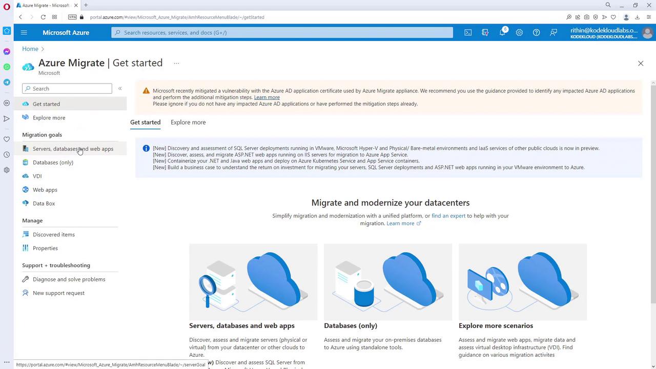 The image shows a Microsoft Azure Migrate portal page with options for getting started, exploring more, and setting migration goals like servers, databases, and web apps. It includes a notification about a vulnerability mitigation and features sections for migrating and modernizing datacenters.