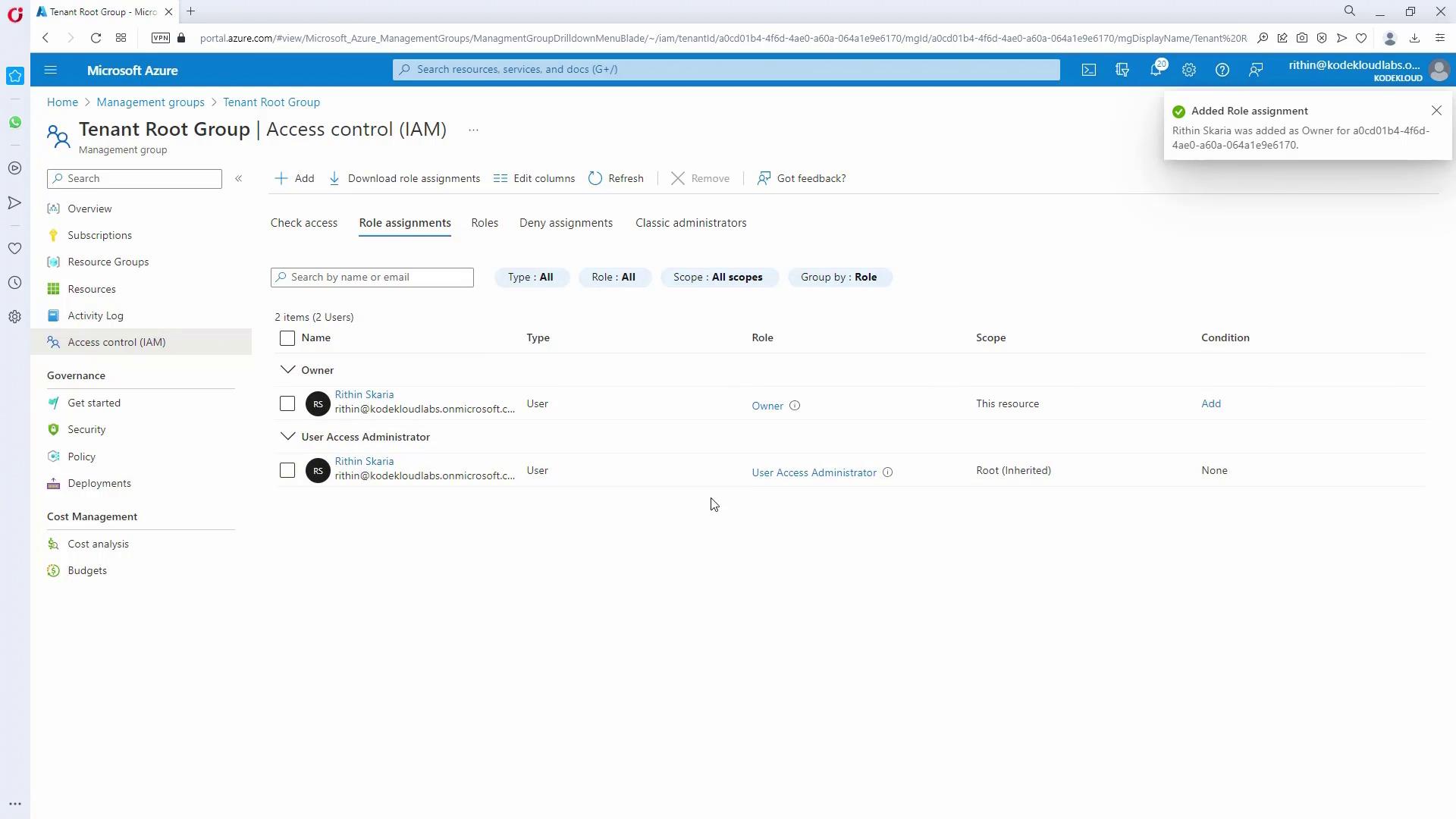 The image shows the Microsoft Azure portal's Access Control (IAM) page for a Tenant Root Group, displaying role assignments for two users with roles of Owner and User Access Administrator.