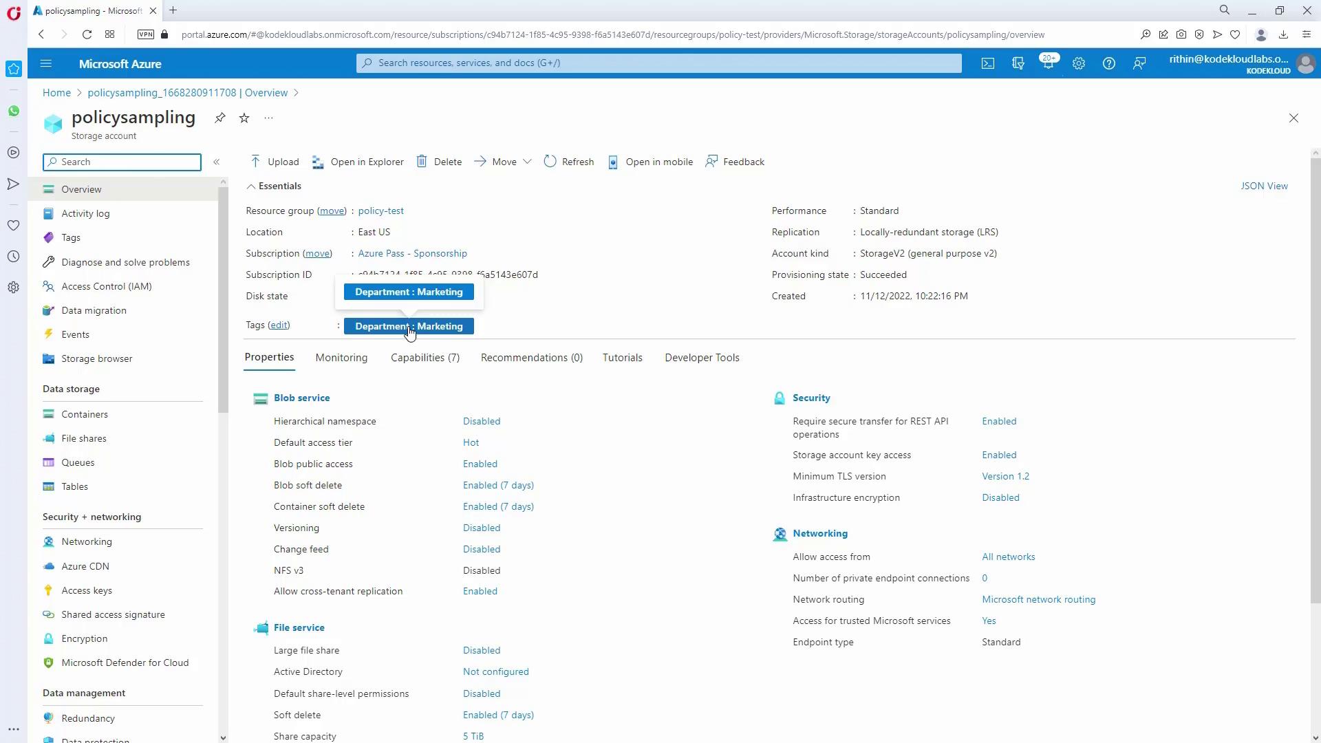 The image shows a Microsoft Azure portal interface displaying the overview of a storage account named "policysampling." It includes details such as resource group, location, subscription ID, and various properties related to blob and file services.