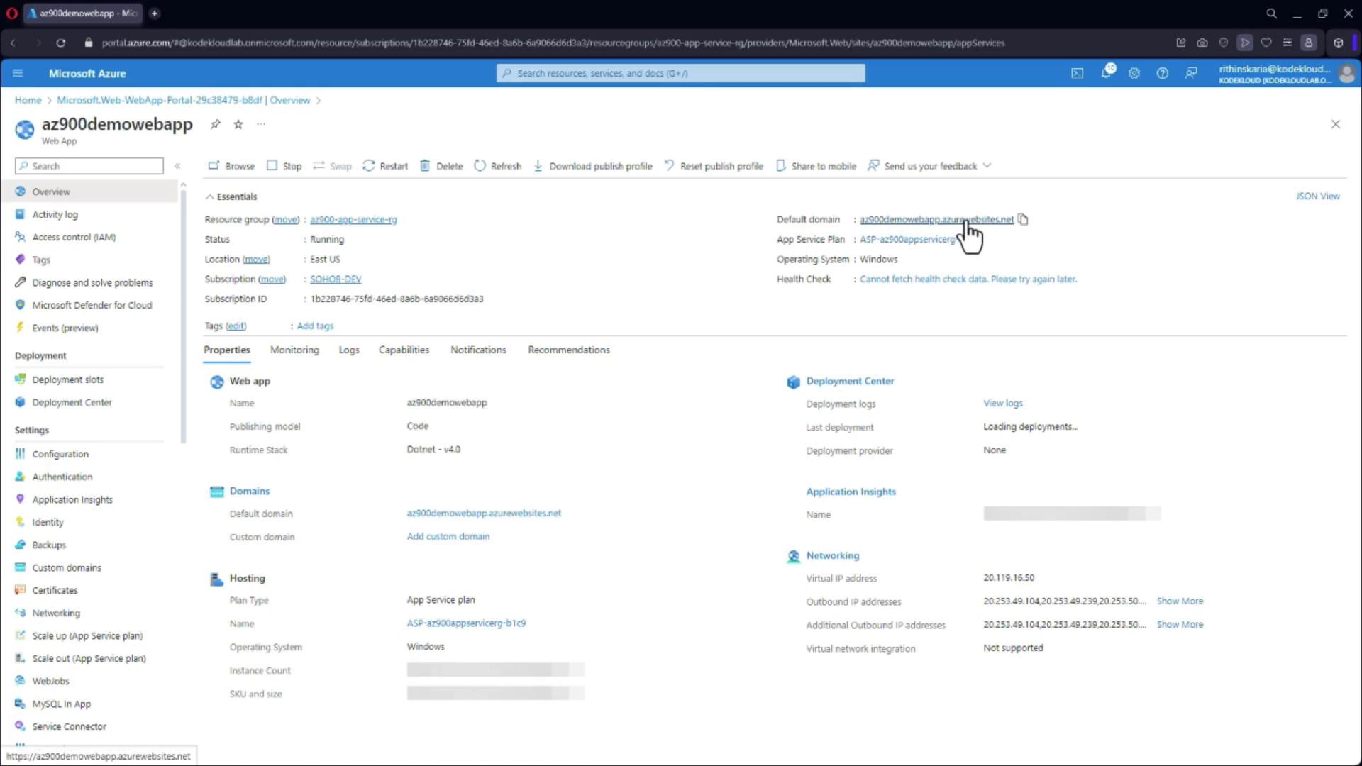 The image shows the Microsoft Azure portal interface for a web app named "az900demowebapp," displaying its properties, deployment settings, and configuration details.