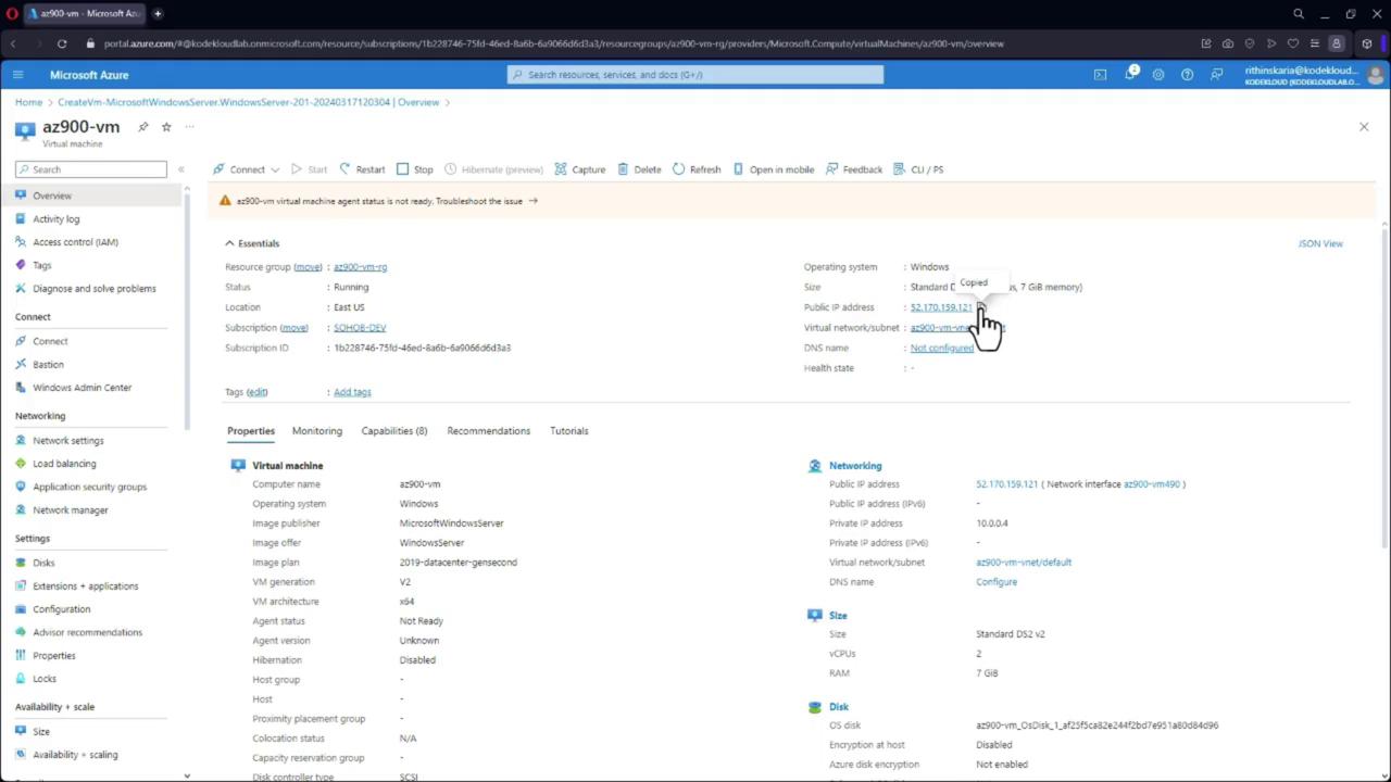 The image shows a Microsoft Azure portal interface displaying details of a virtual machine named "az900-vm," including its status, operating system, and networking information.
