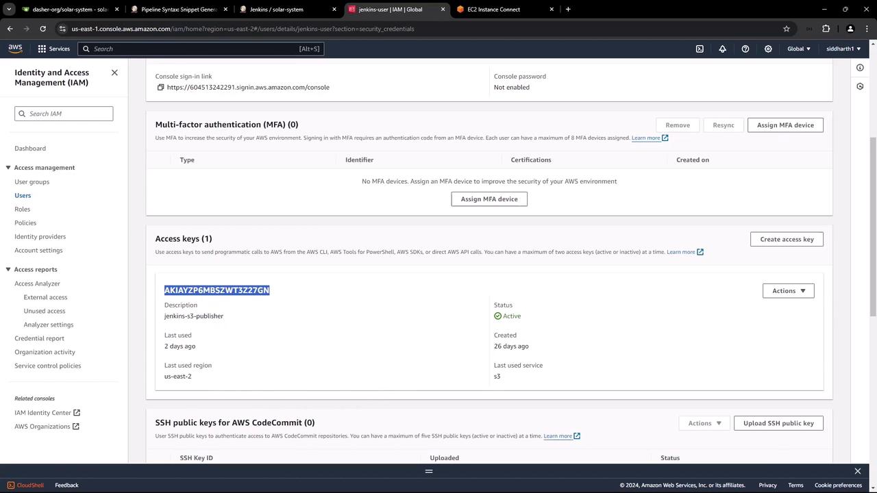 The image shows an AWS Identity and Access Management (IAM) console page, displaying details for a user, including multi-factor authentication settings and an active access key.