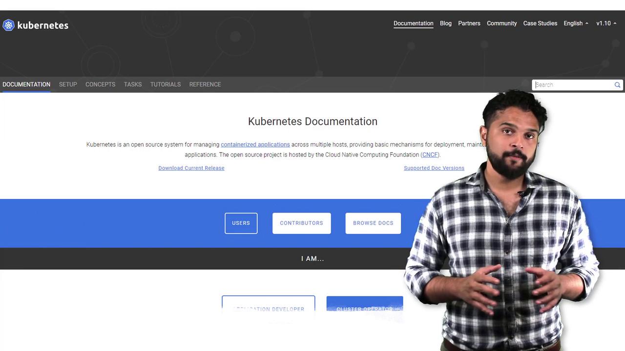 The image shows a man standing in front of a Kubernetes documentation webpage, which provides information on managing containerized applications.