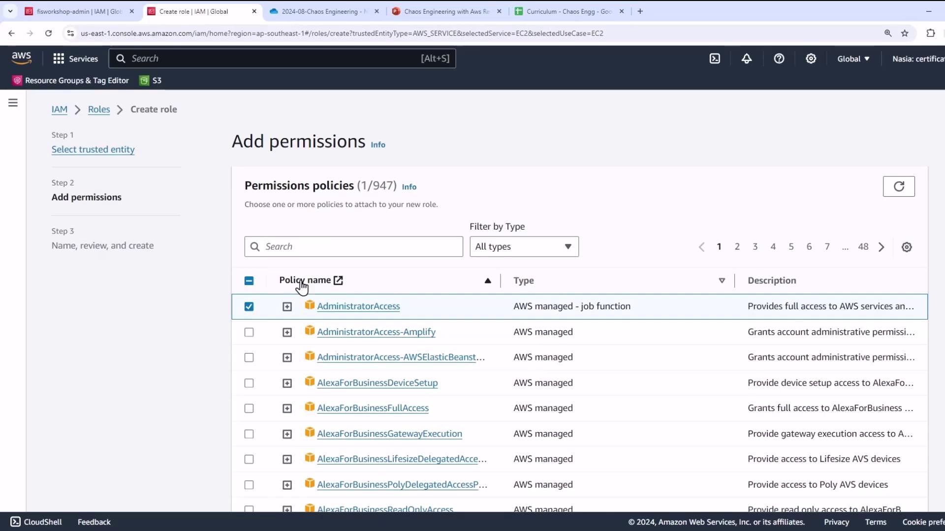 The image shows an AWS IAM console screen where a user is adding permissions to a role, with various AWS managed policies listed.