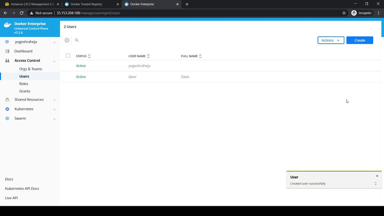 The image shows a Docker Enterprise user management interface with two active users listed. A notification at the bottom indicates a user was created successfully.