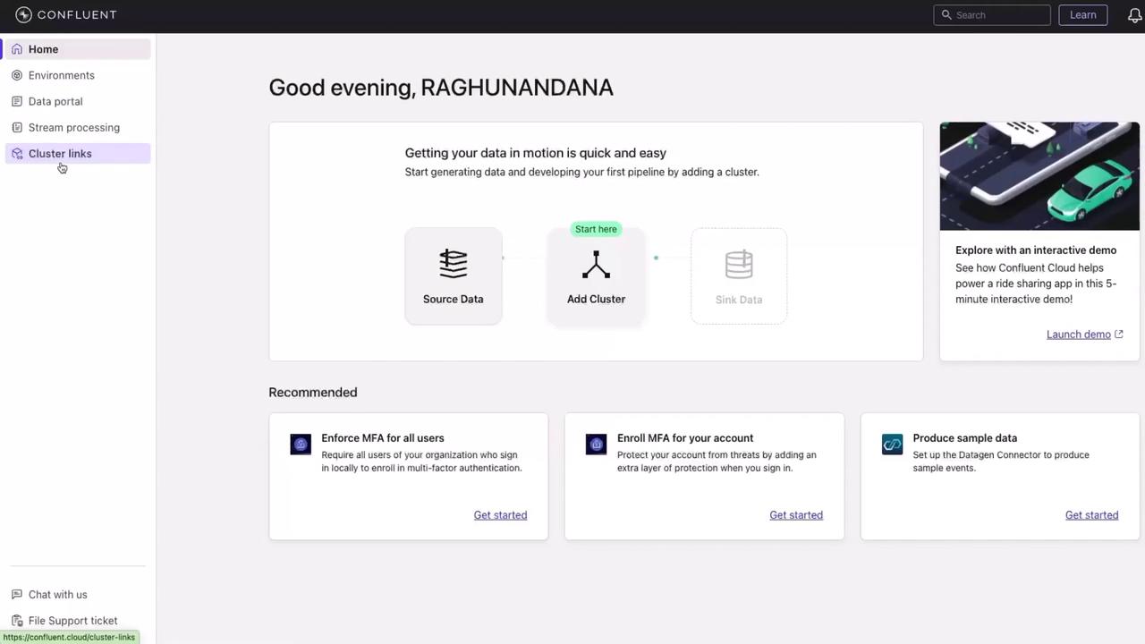 The image shows a dashboard interface for Confluent, featuring options for data processing and cluster management, along with recommendations for multi-factor authentication and sample data production.