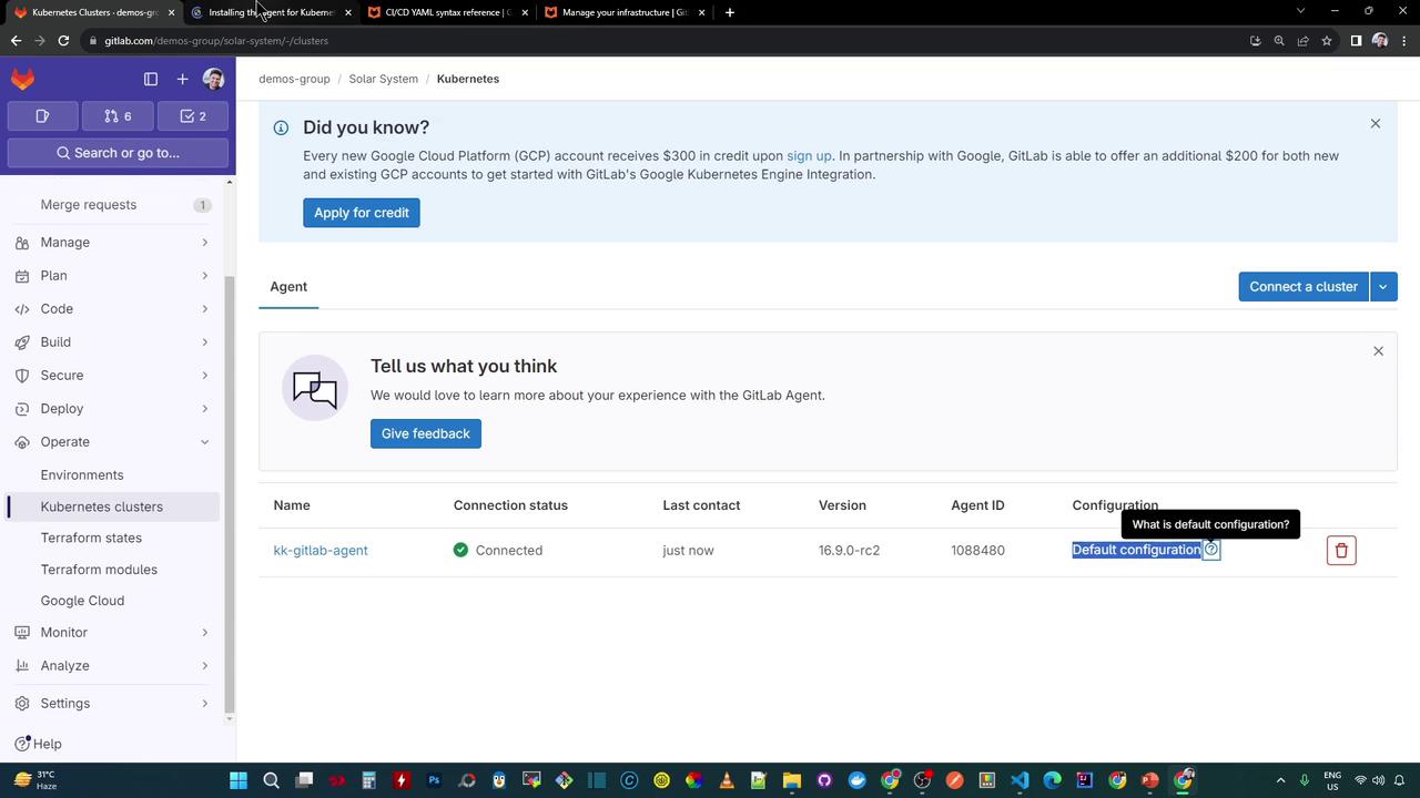 The image shows a GitLab interface displaying Kubernetes cluster details, including connection status, version, and configuration options. There's also a notification about Google Cloud Platform credits and a feedback section.