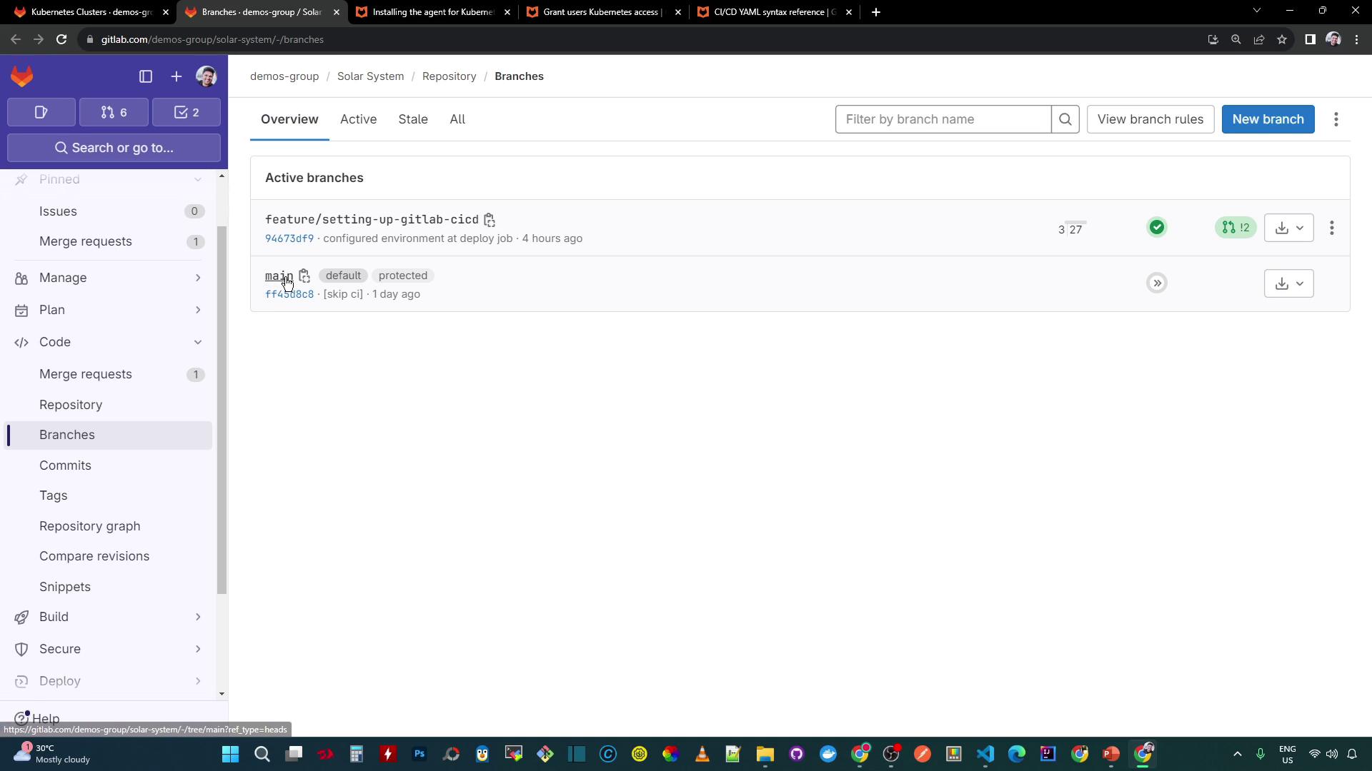 The image shows a GitLab repository page displaying active branches, including "feature/setting-up-gitlab-cicd" and "main," with details about recent commits and branch status.
