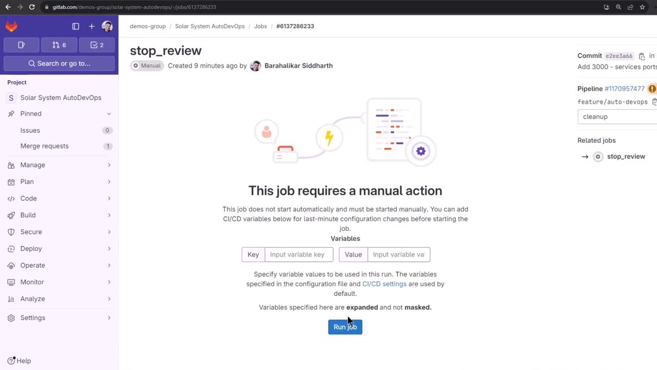 The image shows a GitLab interface indicating a job that requires manual action, with options to input CI/CD variables and a "Run job" button. The sidebar includes project management options like "Manage," "Plan," "Code," and more.
